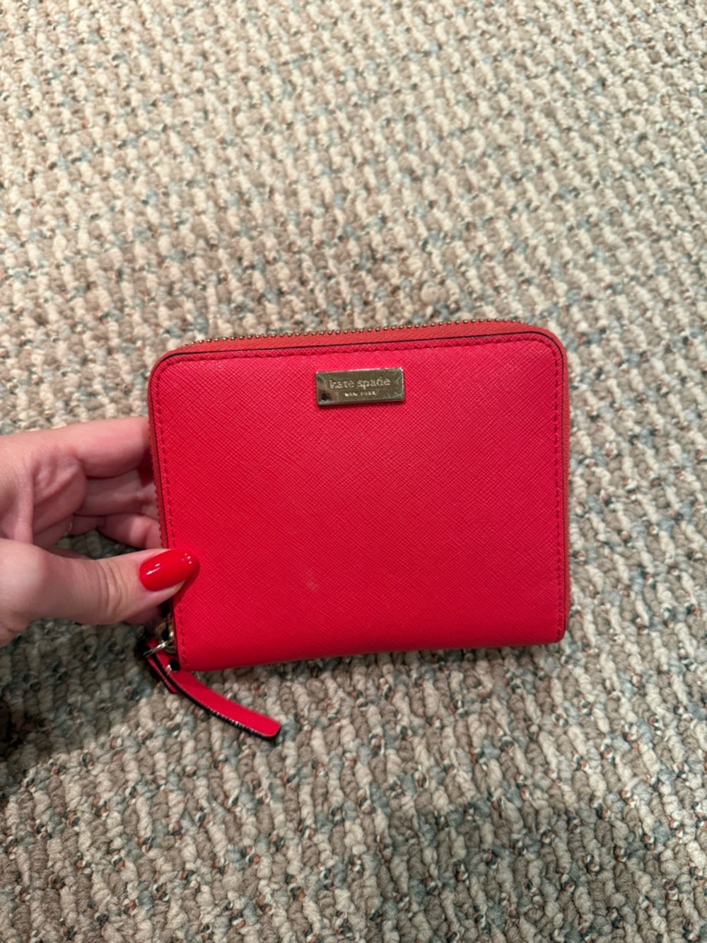 Kate Spade bright red zip-around compact wallet with gold plaque
